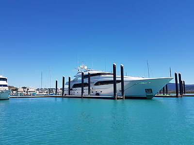 white ship by the dock during daytime thumbnail