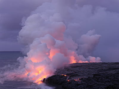 lava on sea with white smoke under grey skly thumbnail