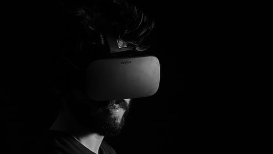 grayscale photography of man using virtual reality headset thumbnail