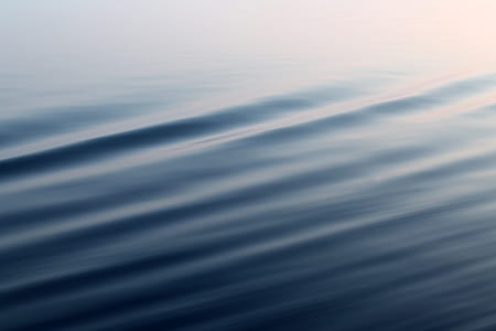 photo of calm body of water at daytime thumbnail