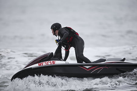 man riding personal watercraft on sea thumbnail