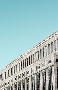 white concrete building with glass windows during daytime thumbnail