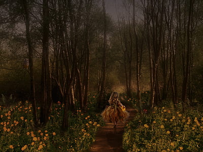 woman walking in the middle of forest with yellow flower field thumbnail