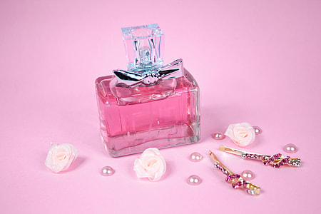 pink tinted glass bottle with white decorative rose flowers and pearl beads with gold pins thumbnail