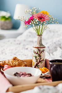 selective focus photography of pink petal flower arrangement in vase thumbnail