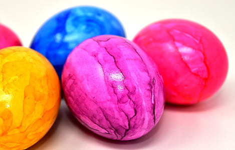 five assorted-color rocks on wooden surface thumbnail