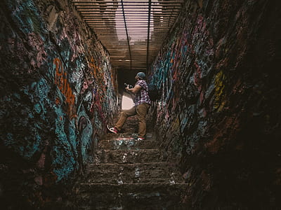 man on ladder with grafitti thumbnail