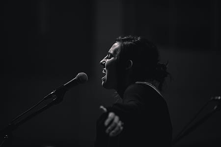 woman singing grayscale photo thumbnail
