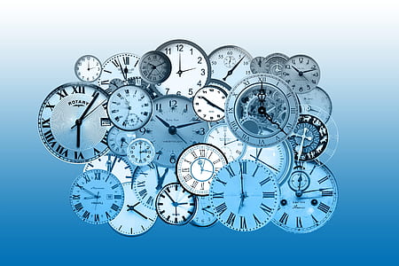 mechanical and analog clock lot against blue background thumbnail