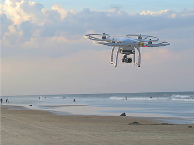 Dji Phantom 3 Professional flying on seashore during daytime thumbnail