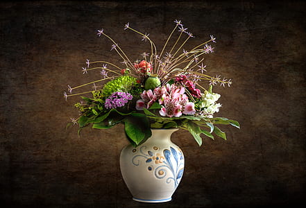 flower bouquet on white ceramic vase thumbnail