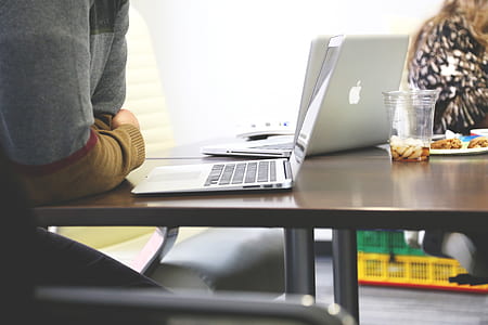 person leaning on table using MacBook thumbnail