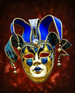 gold and blue Jester mask selective focus photography thumbnail