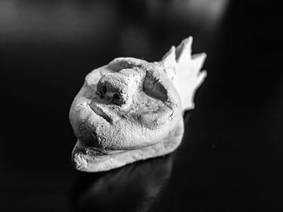 grey stone head decor thumbnail