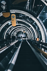 two persons on escalator thumbnail