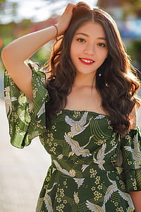 woman wearing green and white off-shoulder dress thumbnail
