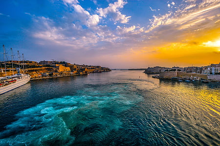 aerial view of body of water and buildings thumbnail