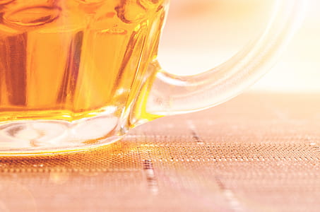 Closeup Photography of Clear Glass Beer Mug Filled With Yellow Liquid thumbnail