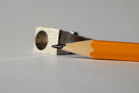 orange pencil near gray single-hole sharpener thumbnail