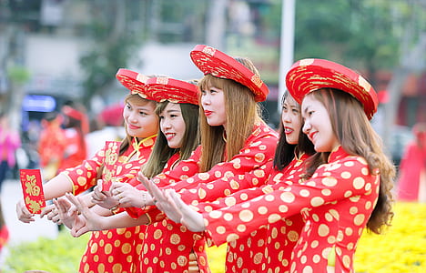 Five Women In Red And White Polka Dot Cheongsam Dress Standing thumbnail