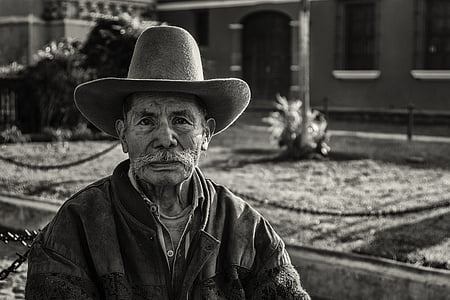 man wearing brown cowboy hat thumbnail