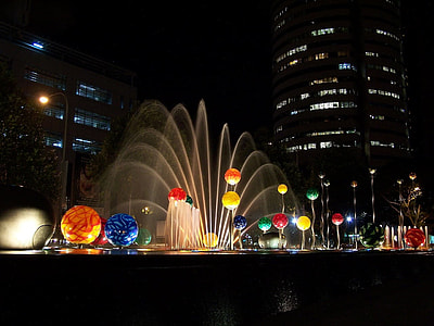 city park fountain during night time thumbnail