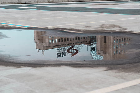reflection of building on water thumbnail
