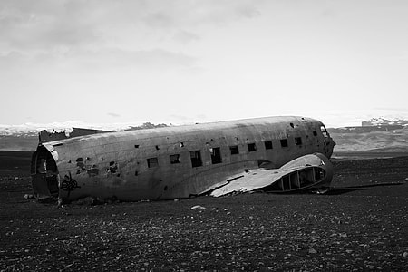 grayscale photography of wrecked airplane thumbnail
