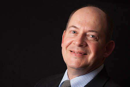 portrait photography of man in black and gray formal tops thumbnail