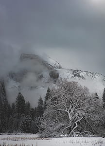 snow-capped mountain surrounded by clouds thumbnail