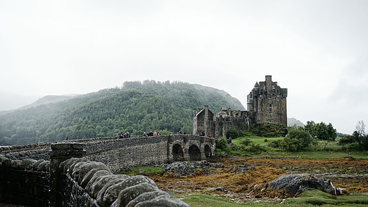 gray concrete castle under cloudy sky at daytime thumbnail