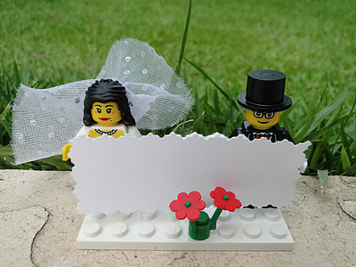 close-up photo of bride and groom minifig figure beside green grasses thumbnail