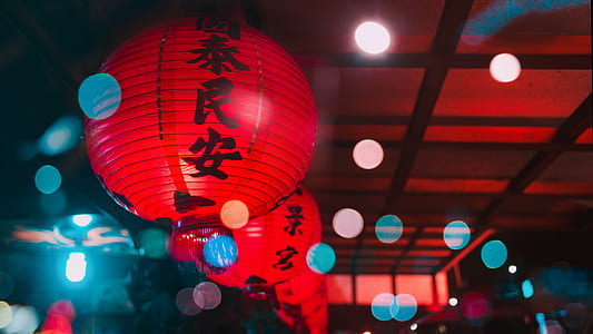 turned on red kanji script lanterns during nighttime thumbnail