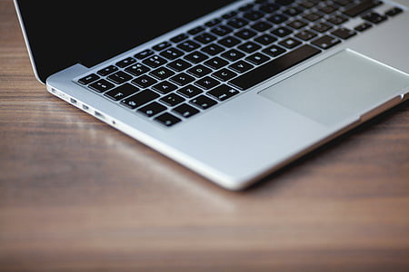 silver Macbook on table thumbnail