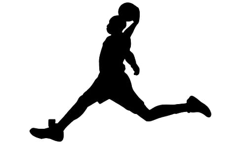 Silhouette of basketball player ready to dunk. thumbnail
