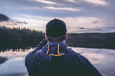 man facing body of water thumbnail