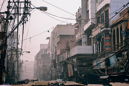 high-rise concrete buildings surrounded by black coated cables thumbnail