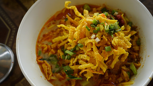 soup dish with spring onions garnish in bowl thumbnail