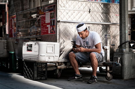 man sitting on box trailer thumbnail