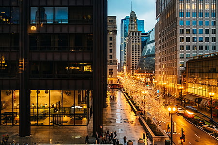 bird's eye view of people crossing on street near buildings thumbnail
