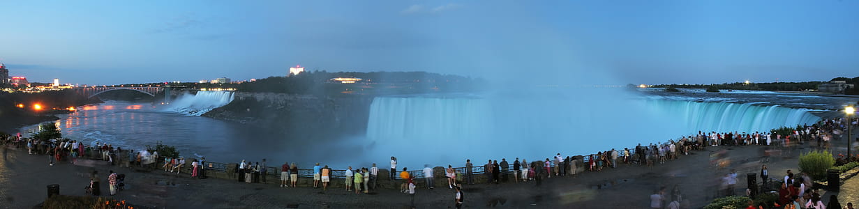 People Standing Near Body of Water thumbnail