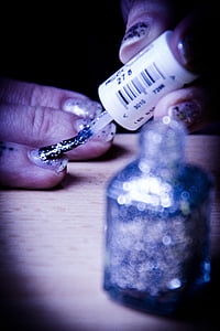 person putting nail polish on nails thumbnail