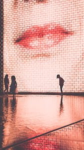 boy standing in front of LED billboard thumbnail