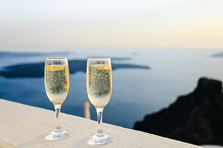 yellow liquid on flute glasses thumbnail