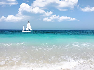 white boat floating on body of water thumbnail