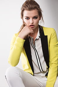 woman wearing yellow jacket and white pants thumbnail