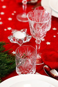 two clear drinking glasses on red textile thumbnail