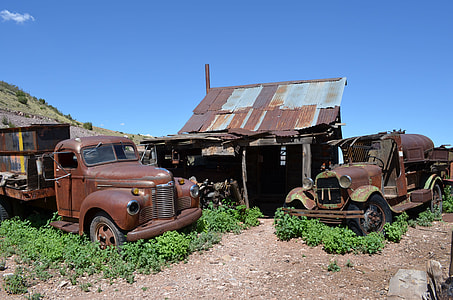 two brown rusty classic cars thumbnail