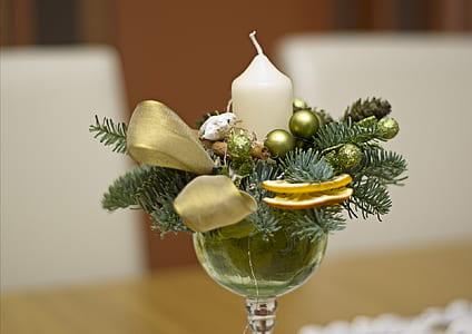 depth of field photo of white pillar candle in wine glass thumbnail