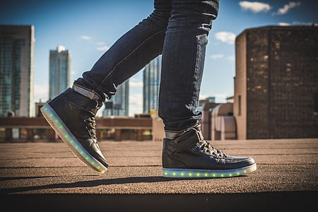 person walking wearing gray shoe thumbnail